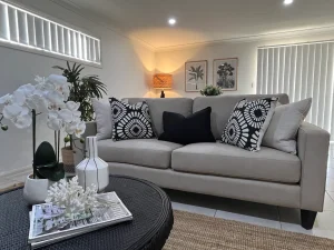 A living room with a couch and a coffee table.